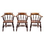A set of six Victorian oak, elm and beech spindleback tub elbow chairs, mid 19th century,