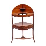 A George III mahogany bow-fronted corner washstand:,