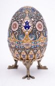 A late 20th century silver gilt and champlevé enamel Easter egg in the Imperial Russian style: