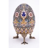 A late 20th century silver gilt and champlevé enamel Easter egg in the Imperial Russian style: