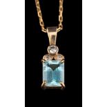 An aquamarine and diamond pendant,: the rectangular cut aquamarine in a four claw setting,