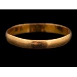 A 22 carat gold ring,: the polished band stamped 22 with full Birmingham hallmarks for 1960,