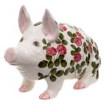 A large Bovey Wemyss pig: modelled seated and decorated with flowering clover, painted Wemyss Ware,