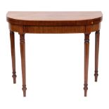 An early 19th Century mahogany and inlaid card table:, of D-shaped outline, bordered with lines,
