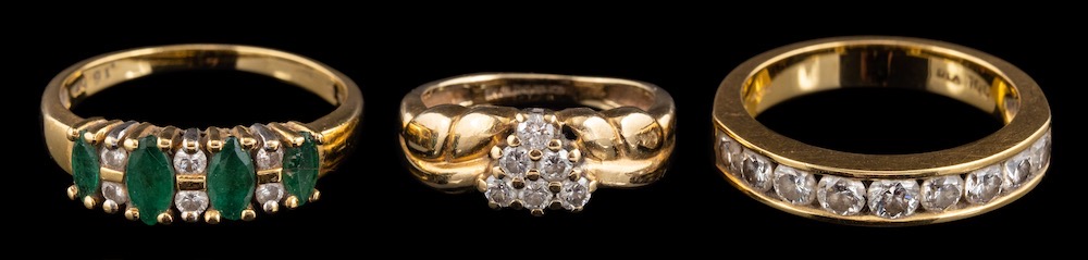 An 18 carat gold diamond half eternity ring,: set with nine brilliant cut diamonds, approximately 0.