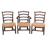 A set of six George III mahogany ladderback dining chairs:,