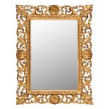 A carved giltwood Florentine frame mirror:, of rectangular shape,