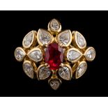 A ruby and diamond ring by Cartier,: the central oval cut ruby estimated to weigh 1.