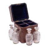 A George III mahogany and boxwood strung decanter case: of rectangular outline with canted corners