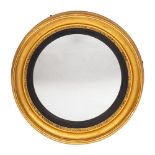An early 19th Century giltwood circular convex mirror:,