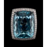 An aquamarine and diamond dress ring,: the rectangular cushion shaped aquamarine,