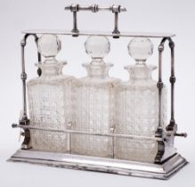 A late Victorian plated tantalus in Christopher Dresser style: of rectangular outline,