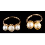A cultured pearl and diamond-set crossover ring,: each cultured pearl set with a single diamond,