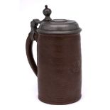 An early 18th century German pewter-mounted brown stoneware cylindrical tankard and a 19th century