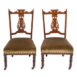 A pair of Edwardian rosewood and marquetry nursing chairs:,