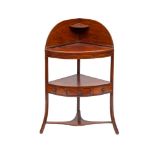 An early 19th Century mahogany and ebony strung bow-fronted corner washstand:,