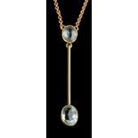 An early 20th century aquamarine pendant,: the oval cut aquamarine in a collet setting,