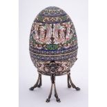 A late 20th century silver gilt and champlevé enamel Easter egg in the Imperial Russian style: