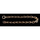 A 9 carat gold bracelet,: composed of fancy links, stamped 375, 20cm long, 18.4g.