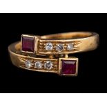 An 18 carat gold, ruby and diamond ring:,