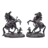 After Guillaume Cousteau (French 1667-1746) a large pair of bronze models of the Marley horses and