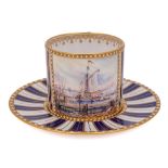 A Lynton Porcelain [Derby] 'jewelled' coffee can and saucer by Stefan Nowacki: painted in Sevres