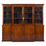 An early 19th Century mahogany breakfront library bookcase:, the upper part with a moulded cornice,