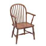 An early 19th Century elm, ash and beechwood stick back Windsor elbow chair:,
