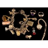 A charm bracelet,: the curb link chain with various charms, including a heart locket, a key, fobs,
