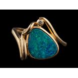 A 14 carat gold boulder opal and diamond ring,: the pear shaped boulder opal in a collet setting,