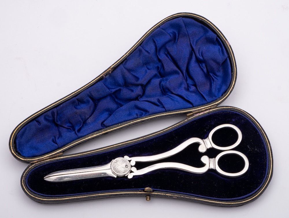 A George V silver pair of grape shears, maker William Hutton & Sons Ltd, Sheffield,