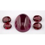 A group of loose garnets,: an oval cabochon garnet and three oval cut garnets, approximately 62.