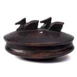 A carved wood oval bowl and cover, probably Polynesian: with finial in the form of two ducks,