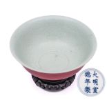 A Chinese sang-de-boeuf bowl: with flaring rim and rounded sides,