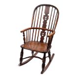 A provincial elm and ash high back Windsor rocking chair, first half 19th century,