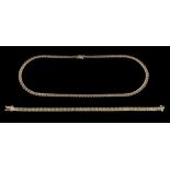 A 9 carat gold necklace,: the articulated fancy link necklace with textured detail,