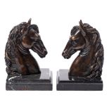 A pair of 20th century bronze book ends,