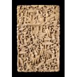 A Chinese Canton ivory card case: carved overall in traditional style with numerous figures,