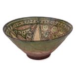 A Persian sgraffito decorated bowl: of conical form the interior incised with animals and circular