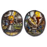 A pair of 17th century South German stained glass oval panels: of a saint kneeling before an altar