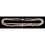 A double strand cultured pearl necklace,: the two strands of 9mm to 3mm cultured pearls,