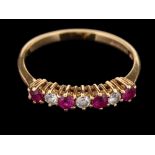 An 18 carat gold ruby and diamond ring,