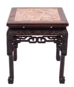 A Chinese hardwood stand with marble top: carved with scrolling foliage above a pierced freize,