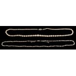 A pearl and diamond necklace,: the single strand necklace with 2.