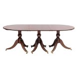 A mahogany D-end three pillar dining table:, the top with a rounded edge,