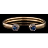 A sapphire and diamond bangle,