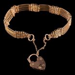 A 9 carat gold gate link bracelet,: the six row bracelet with a padlock clasp, stamped 9c,