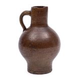 A small late 17th century brown stoneware bottle: with ribbed neck and foot,