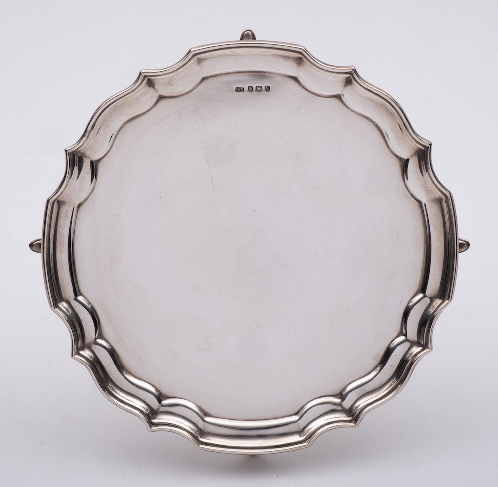 An Elizabeth II silver salver, maker HyC, Sheffield, 1963: of plain circular form, with moulded rim,