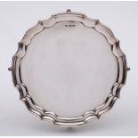 An Elizabeth II silver salver, maker HyC, Sheffield, 1963: of plain circular form, with moulded rim,